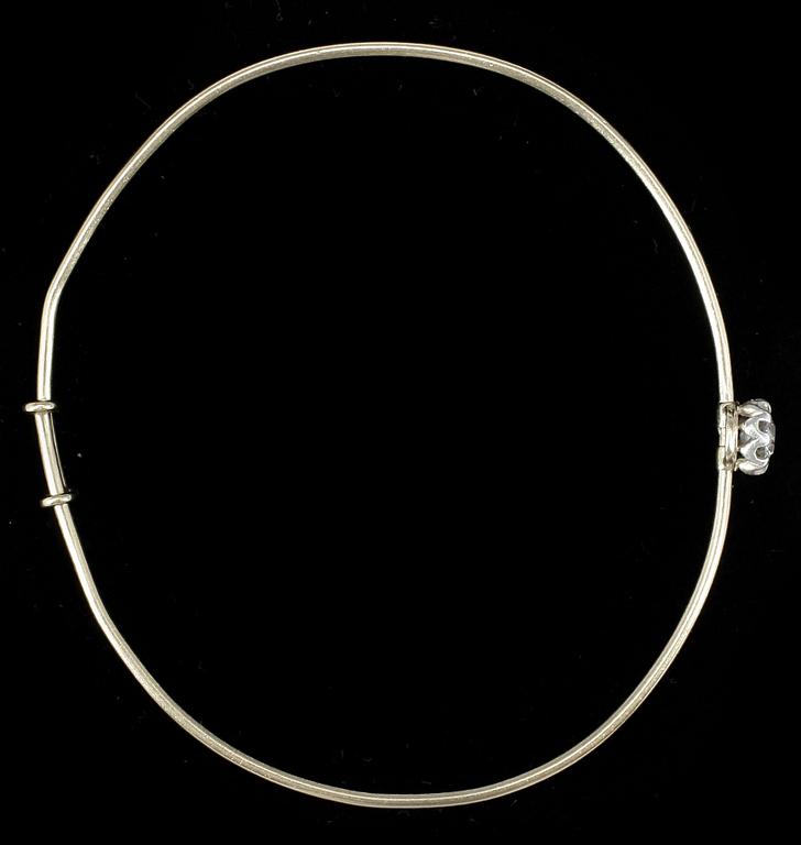 ARMRING, 18k guld samt antikslipad diamant ca 0.5 ct. Vikt ca 7,2 gram.