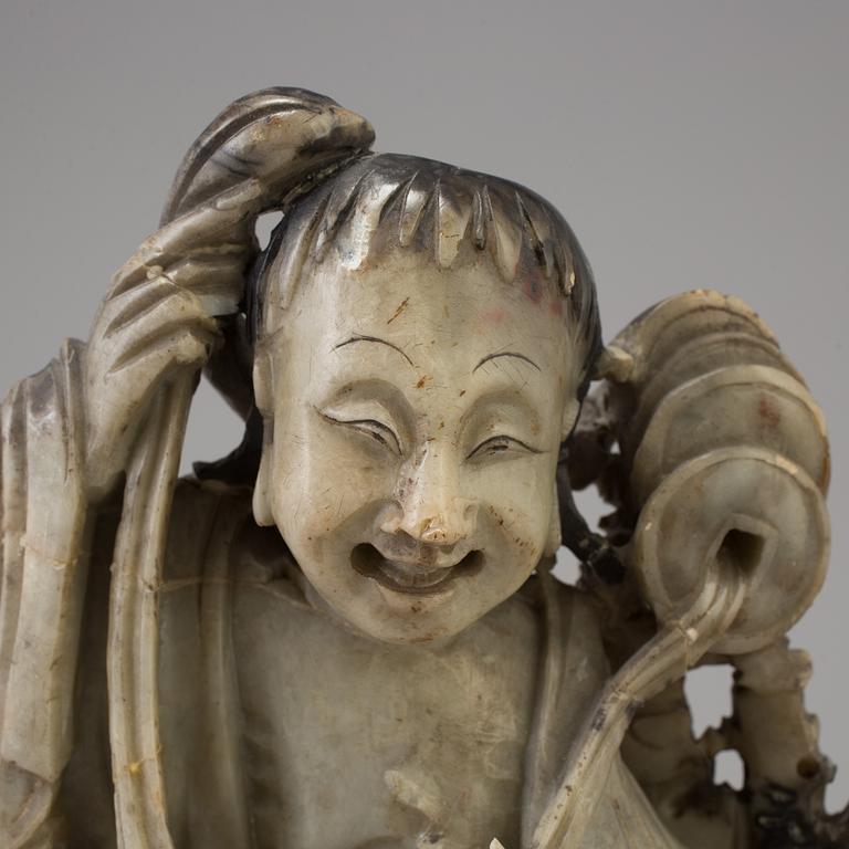 a 19th century chinese soapstone figure.