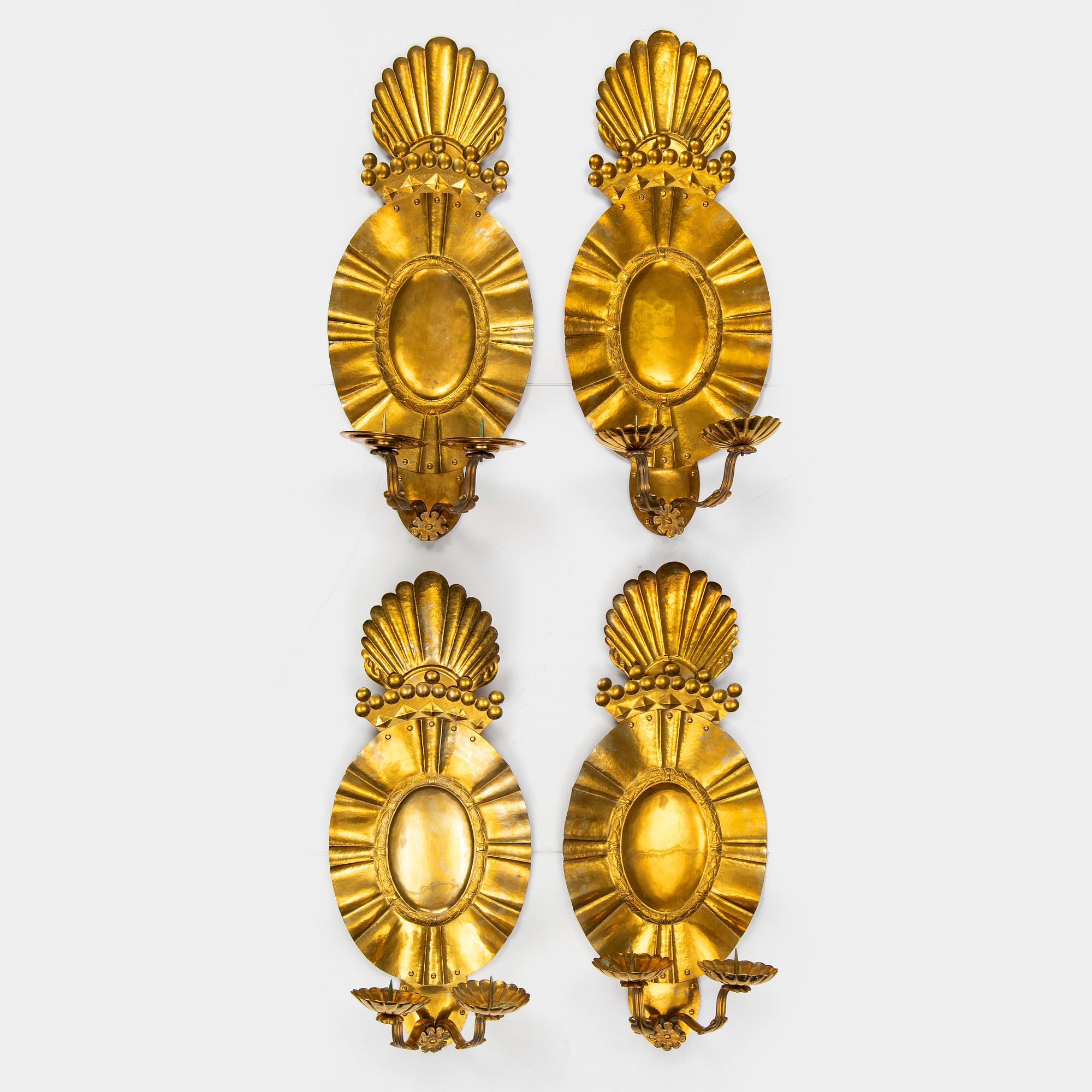 A set of four baroque style brass wall sconces, probably 1950s.