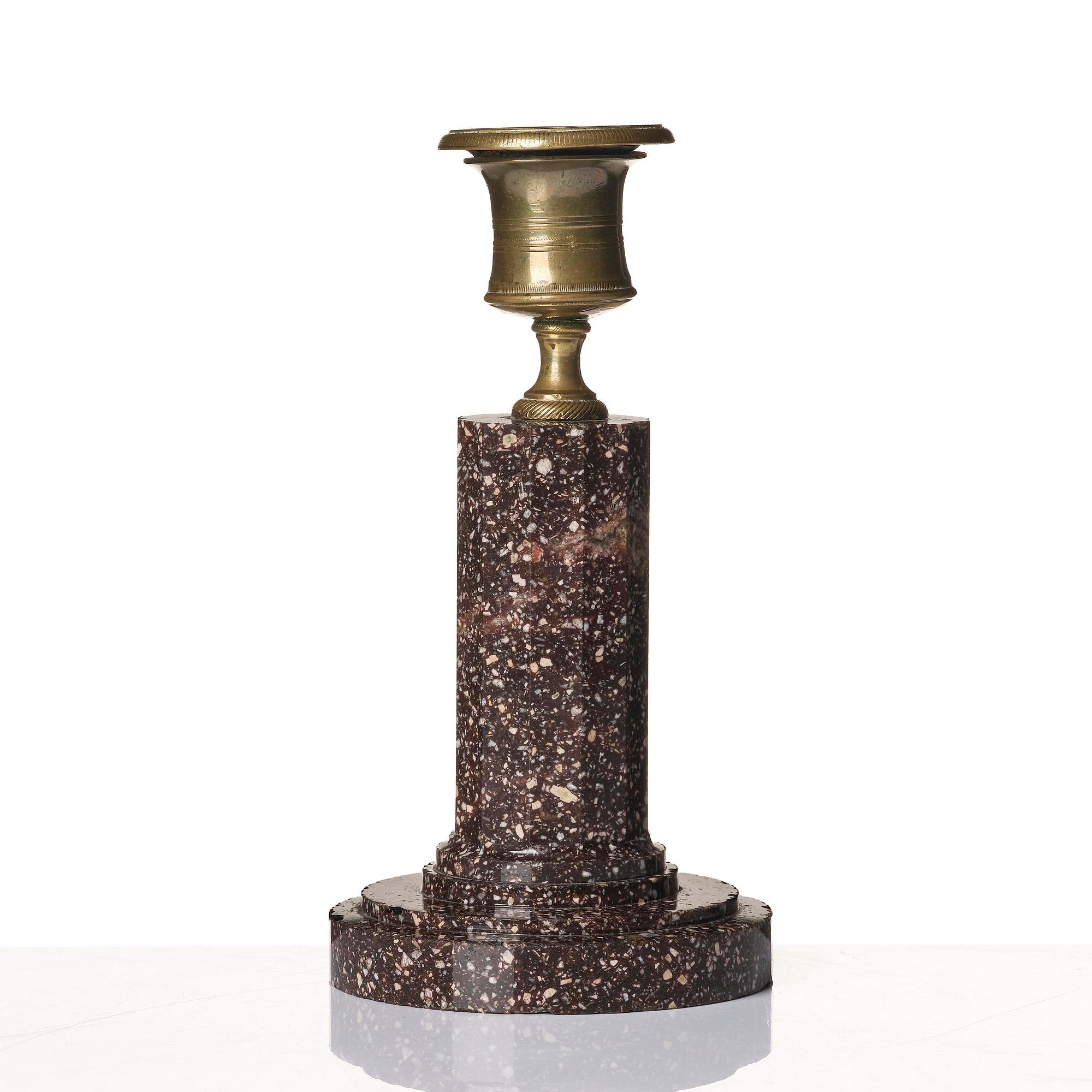 An Empire 'Blyberg' porphyry candlestick from Älvdalen, first part 19th century.
