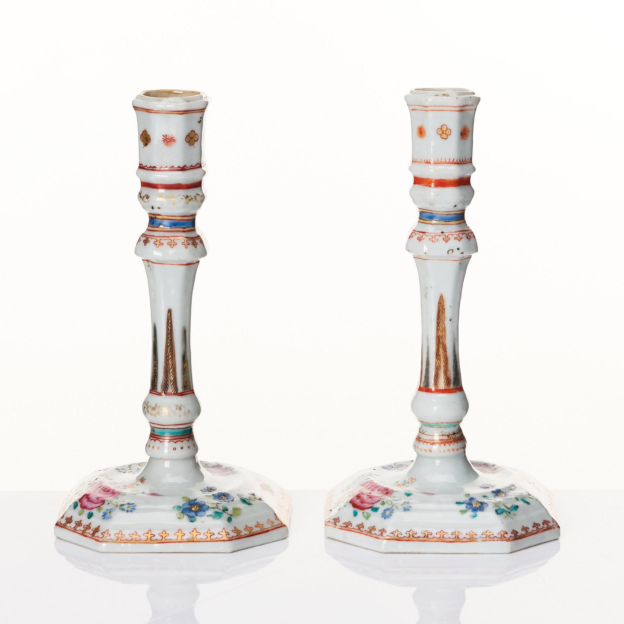 A pair of famille rose candles sticks, Qing dynasty, Qianlong (1736-95).