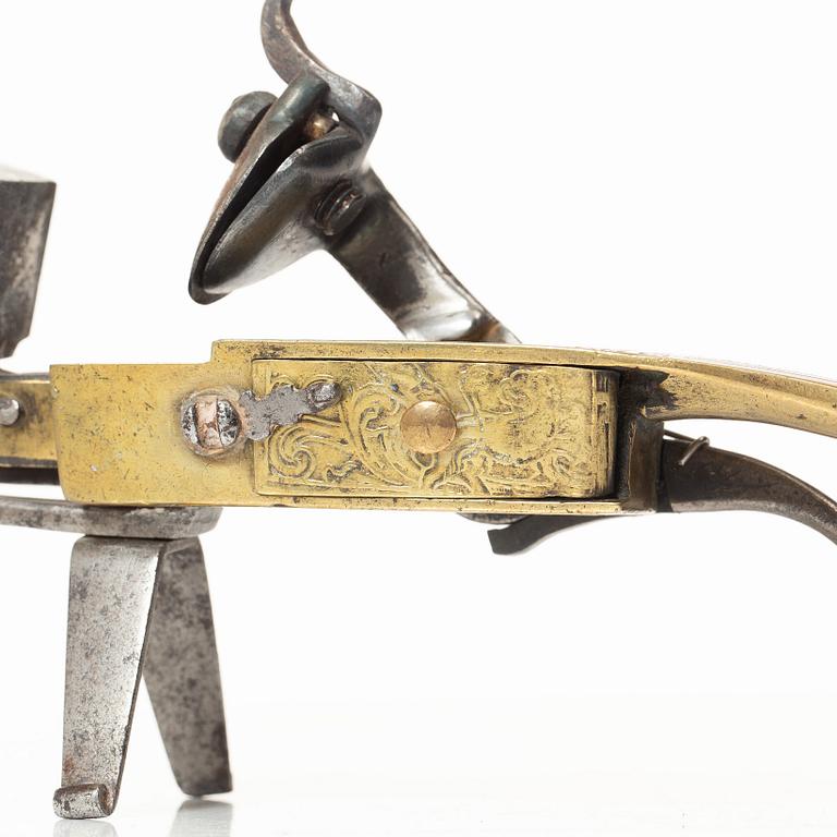 A Northern European flintlock lighter, mid 18th century.