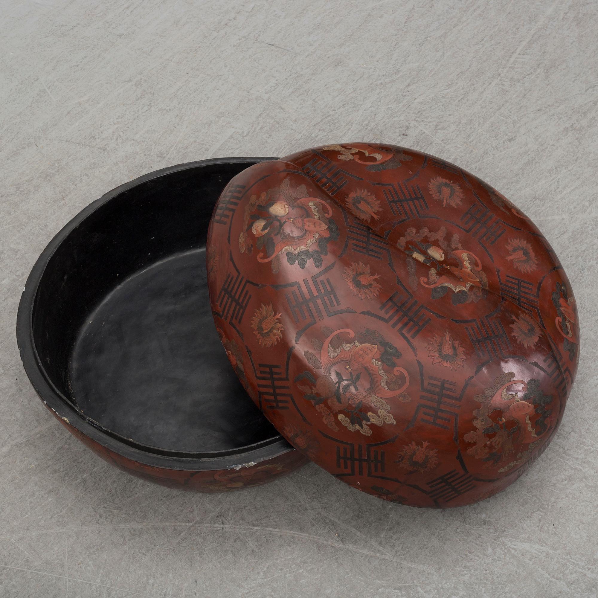 A massive Japanese wooden and lacquered box with cover, in the shape of a peach, early 20th century.