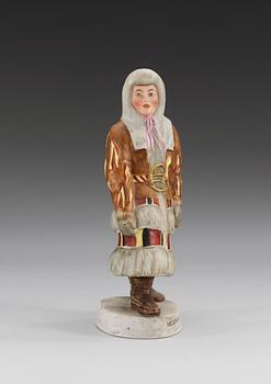 A Russian bisquit figure of a Samoyed woman from Mezen, Central Porcelain Trust, Dimitrovski, Verbilki, Moscow, 20th Century.