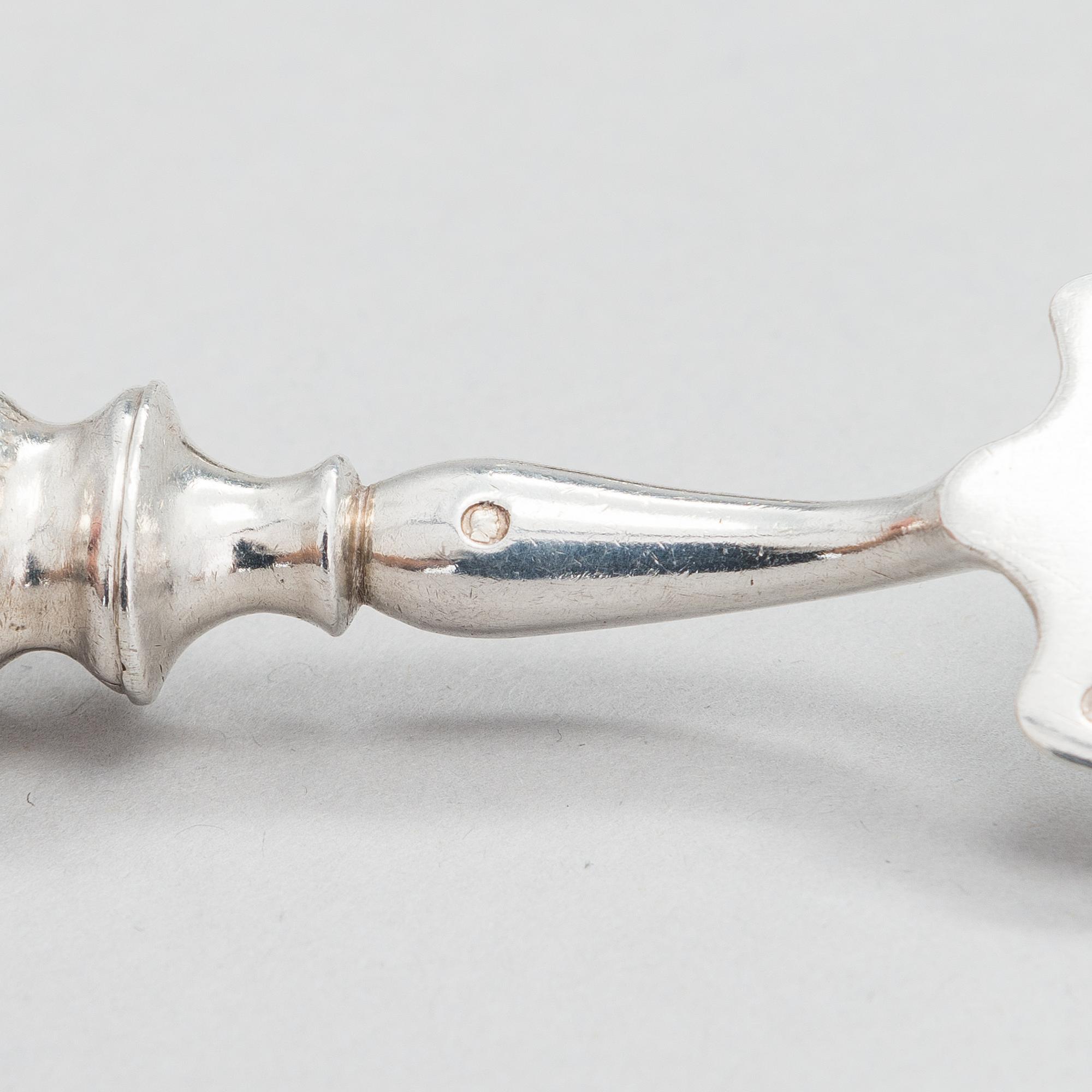 Four pieces of Russian silver cutlery.