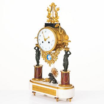 A late Gustavian marble and ormolu portico mantel clock, late 18th century.