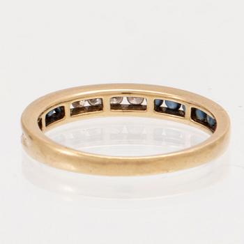 An 18K gold ring and a pair of earrings by H. Stern set with round brilliant cut diamonds and sapphires.