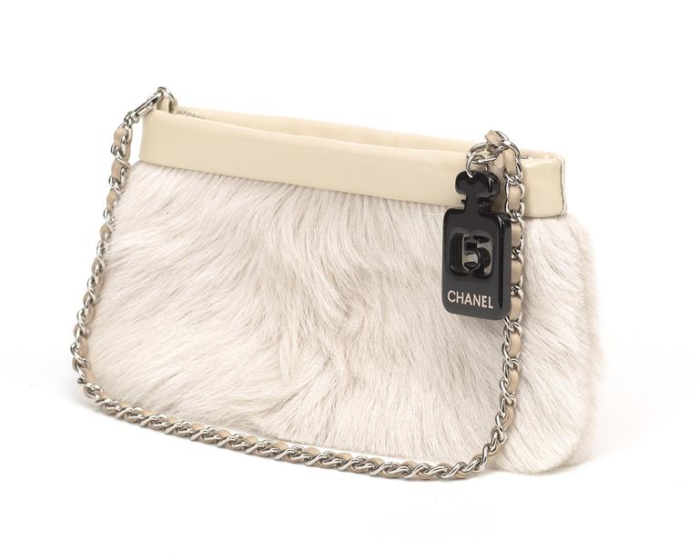 An rabbit fur evening bag by Chanel.