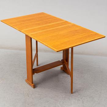 A mid 20th Century gate-leg table.