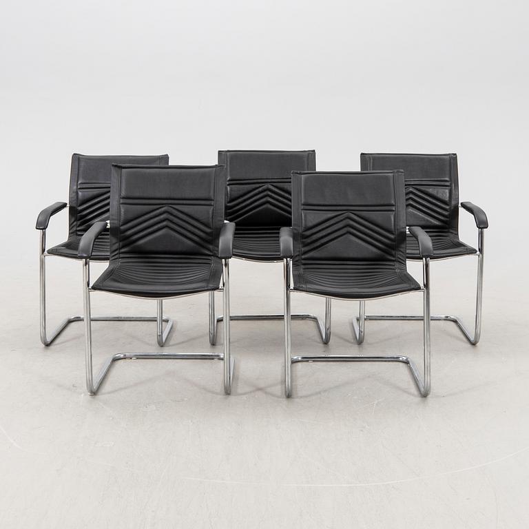 A set of five chrome and leather armchairs alter part of the 20th century.