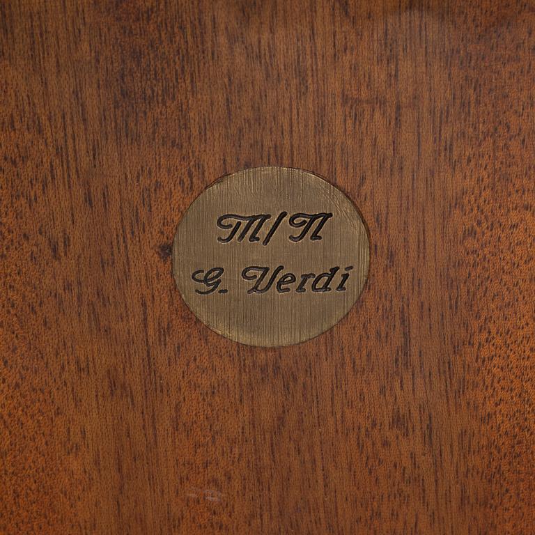 A brass and mahogany ships chair, from the ship Giuseppe Verdi, first half of the 20th Century.