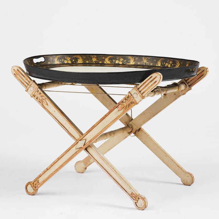 A tole-peinte Empire tray, first part 19th century on a later stand.