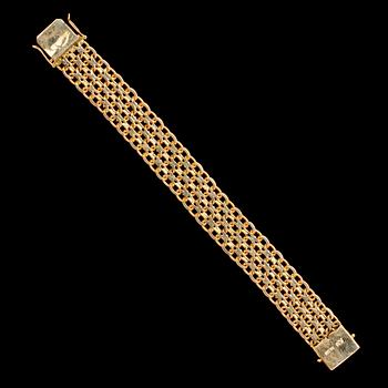 BRACELET, two colours of gold. Weight 62,7 g.