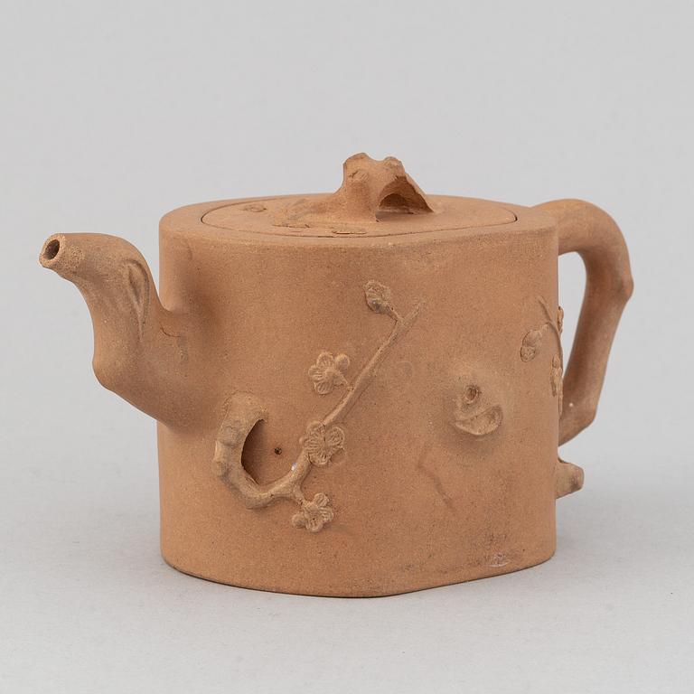 A Yixing pottery tea pot with cover, China, 20th Century, with seal mark.