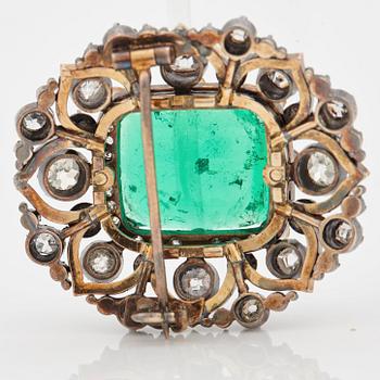 An emerald, black enamel and old cut diamond brooch. 19th century.