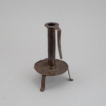 An 18th century cast iron candlestick.