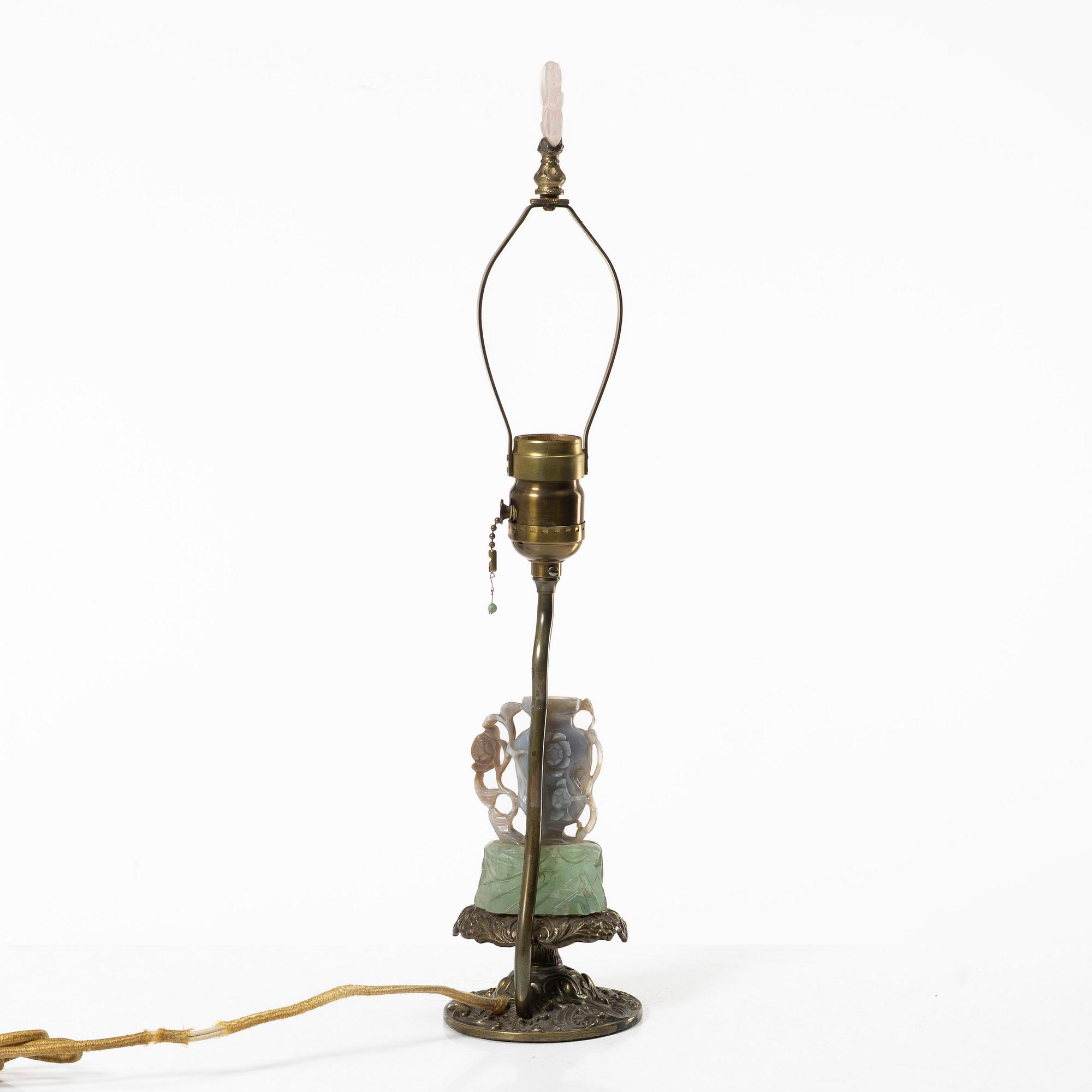 A Chinese table lamp with a carved stone vase with cover, 20th century.