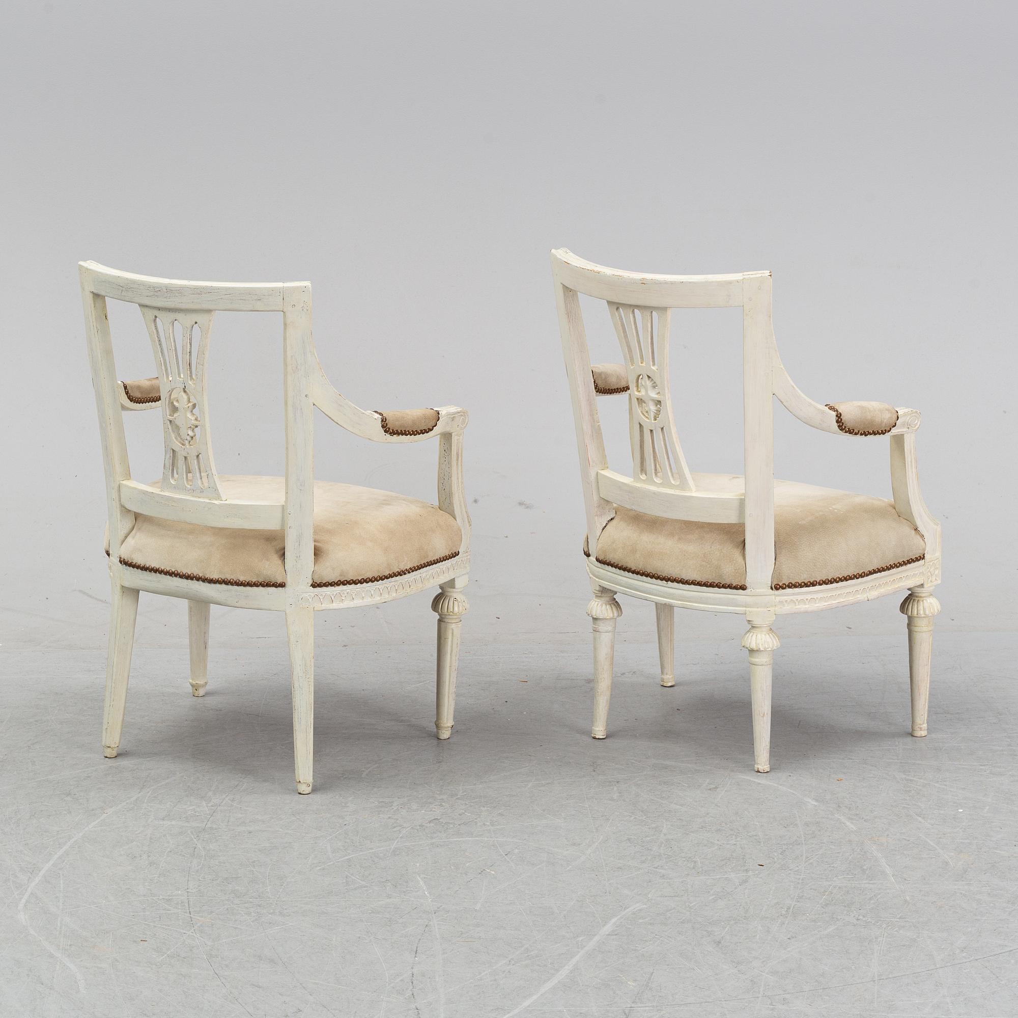 A set of two Gustavian arm chairs from the early 19th Century.