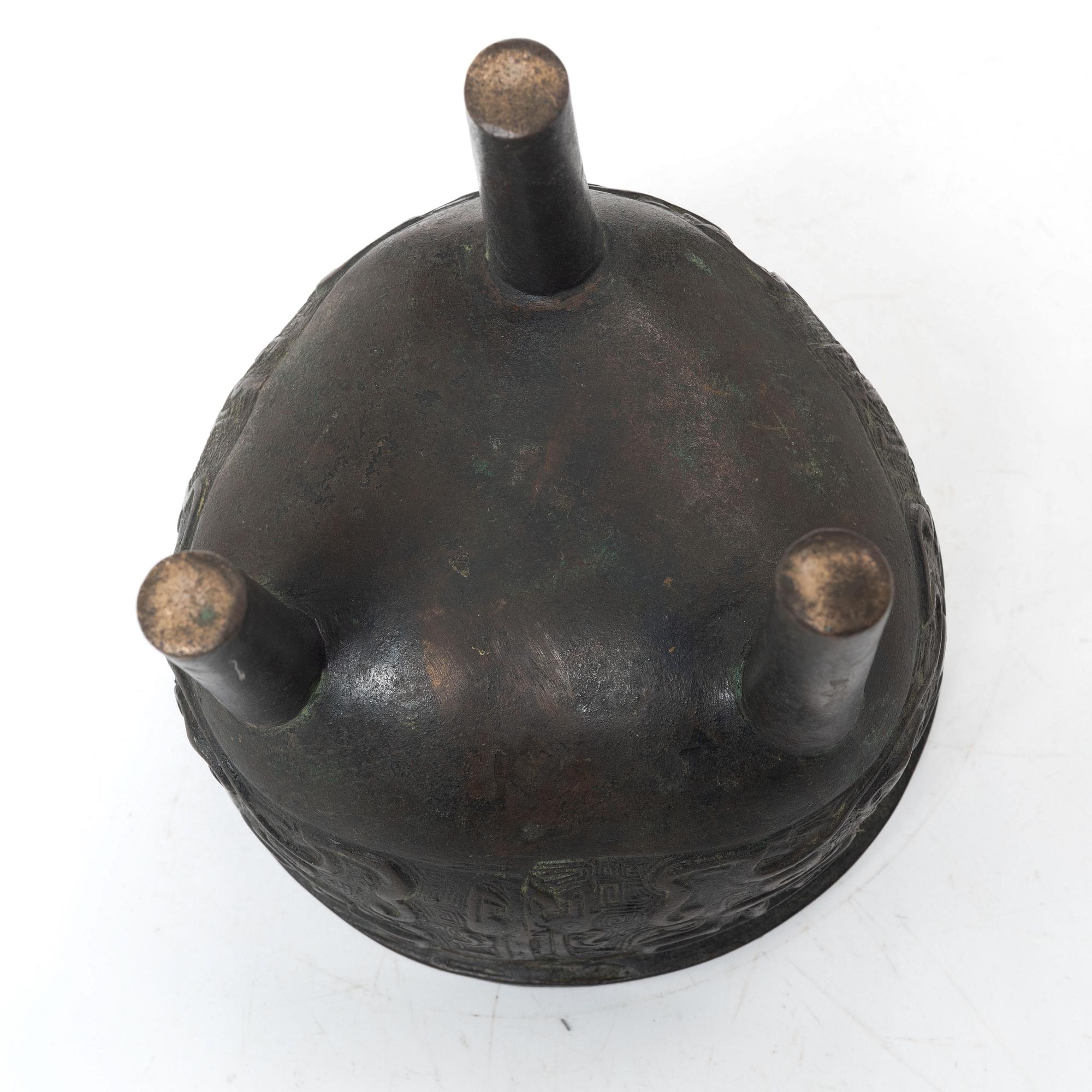 A Chinese tripod bronze censer, Ming style, Qing dynasty (1644-1912).