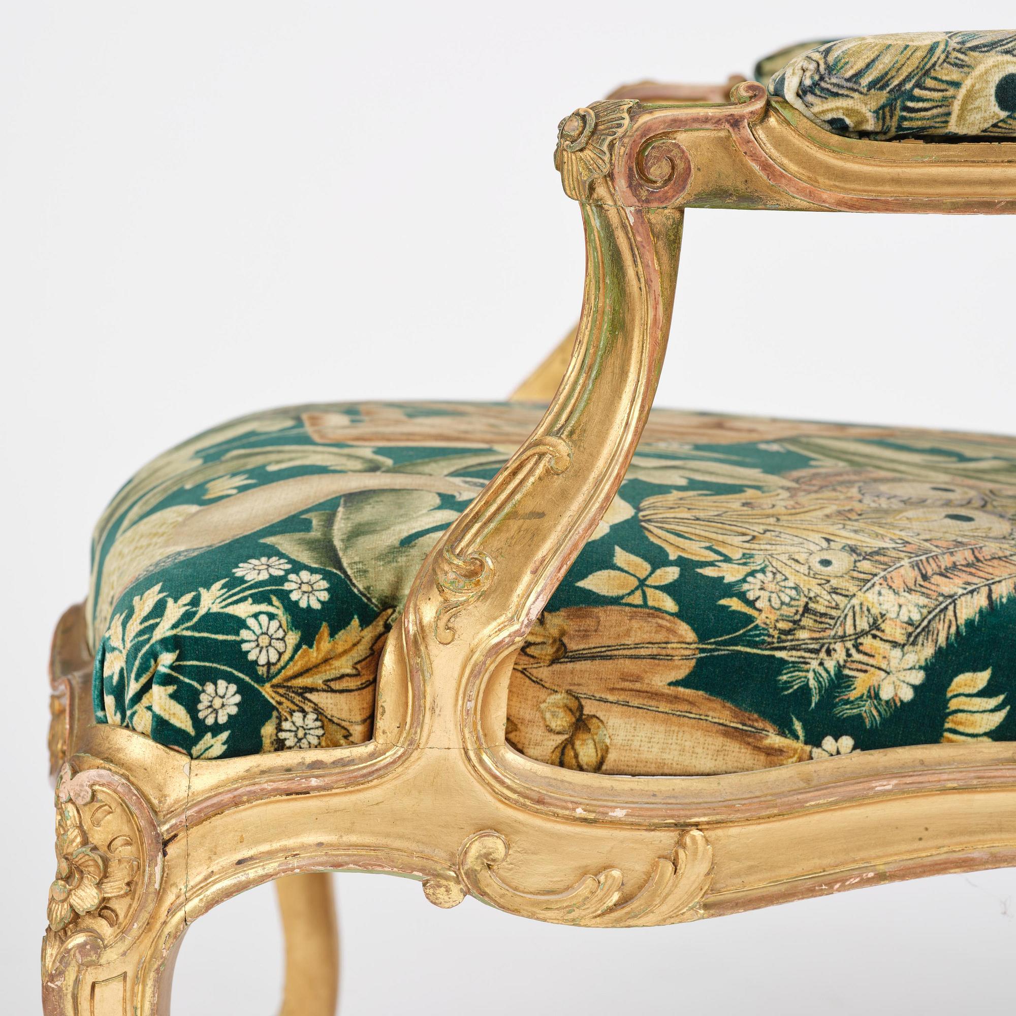A pair of Louis XV-style giltwood fauteuils, late 19th century.