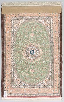 A silk Qum rug, circa 152 x 101 cm.