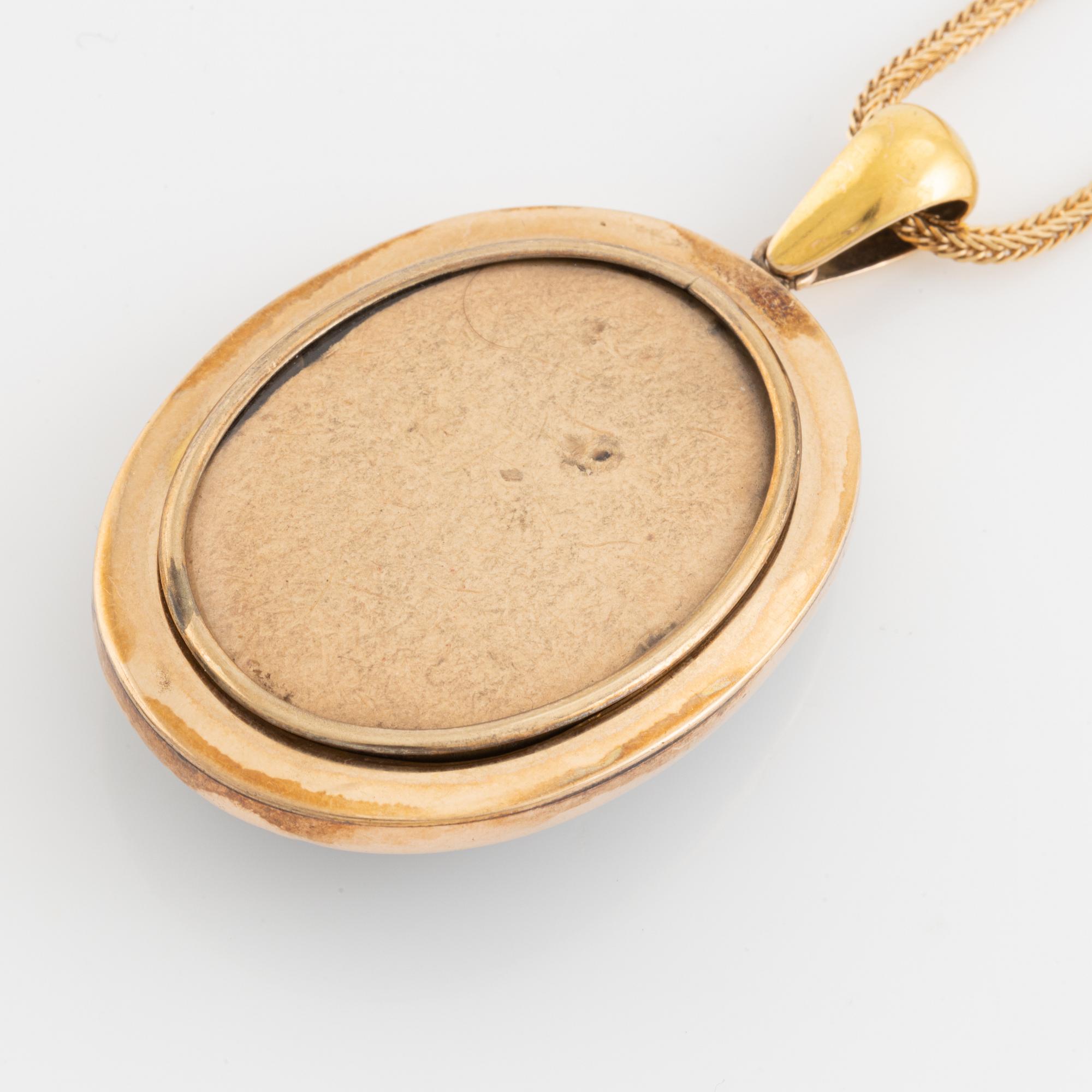 Black stone and seed pearls locket, with chain.