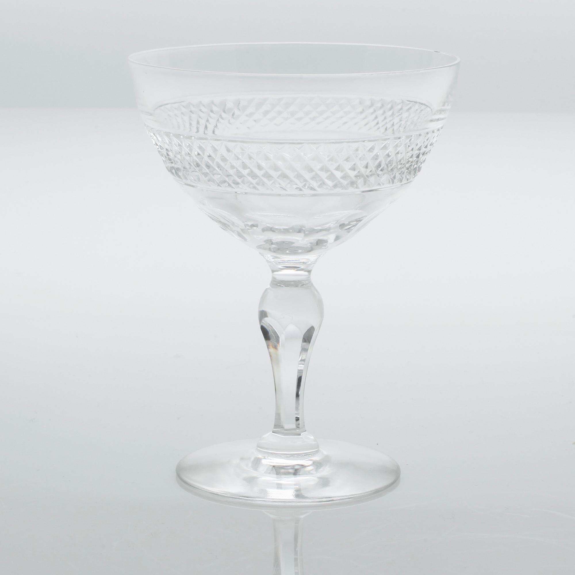 Eleven glass champagne cups, around mid 20th century.