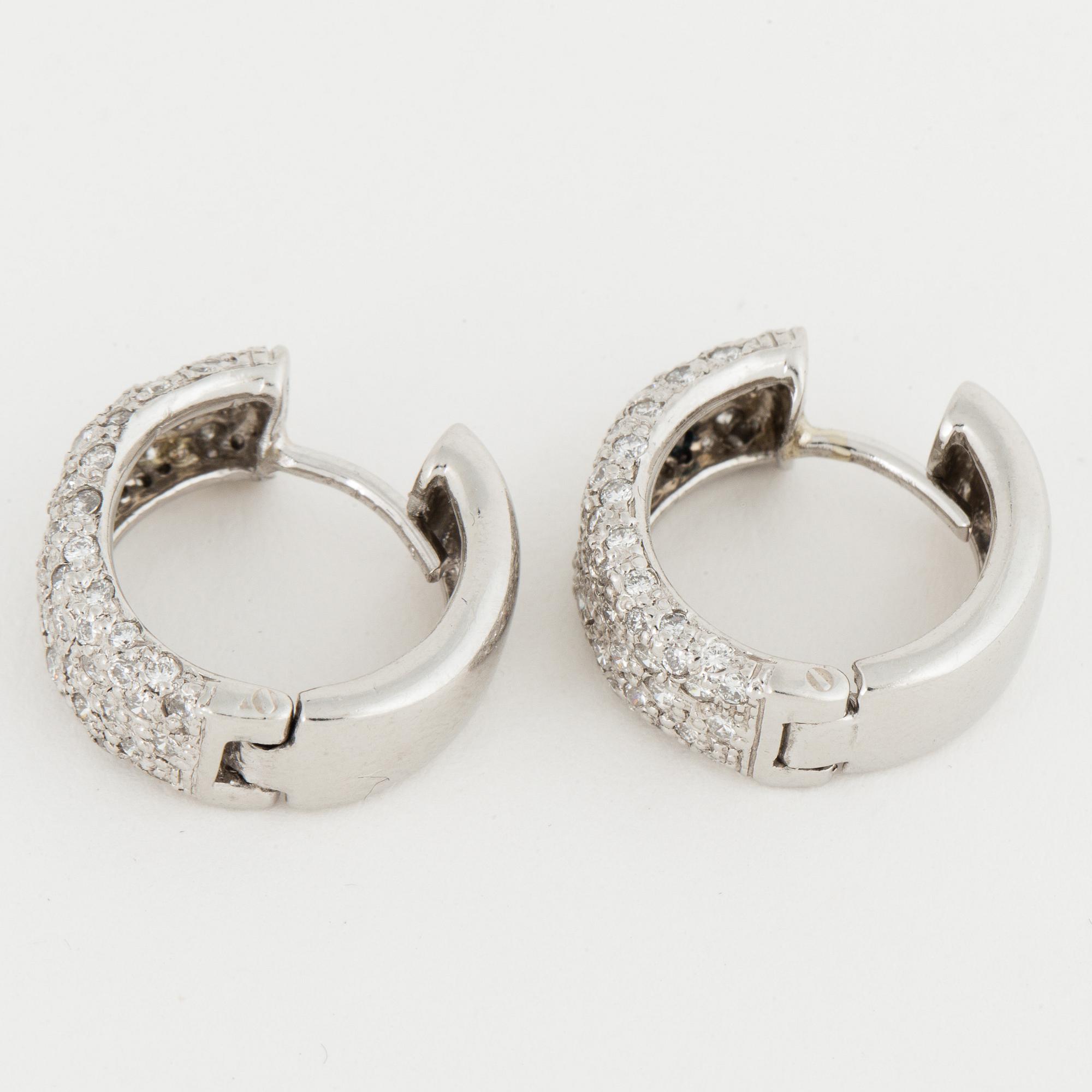 Platinum and brilliant-cut diamond earrings.