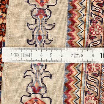 A chinese silk rug, ca 152,5 x 92,5 cm.