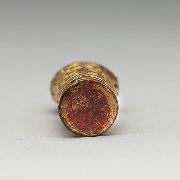 A Tibtean gilt bronze seal, presumably 18th Century.