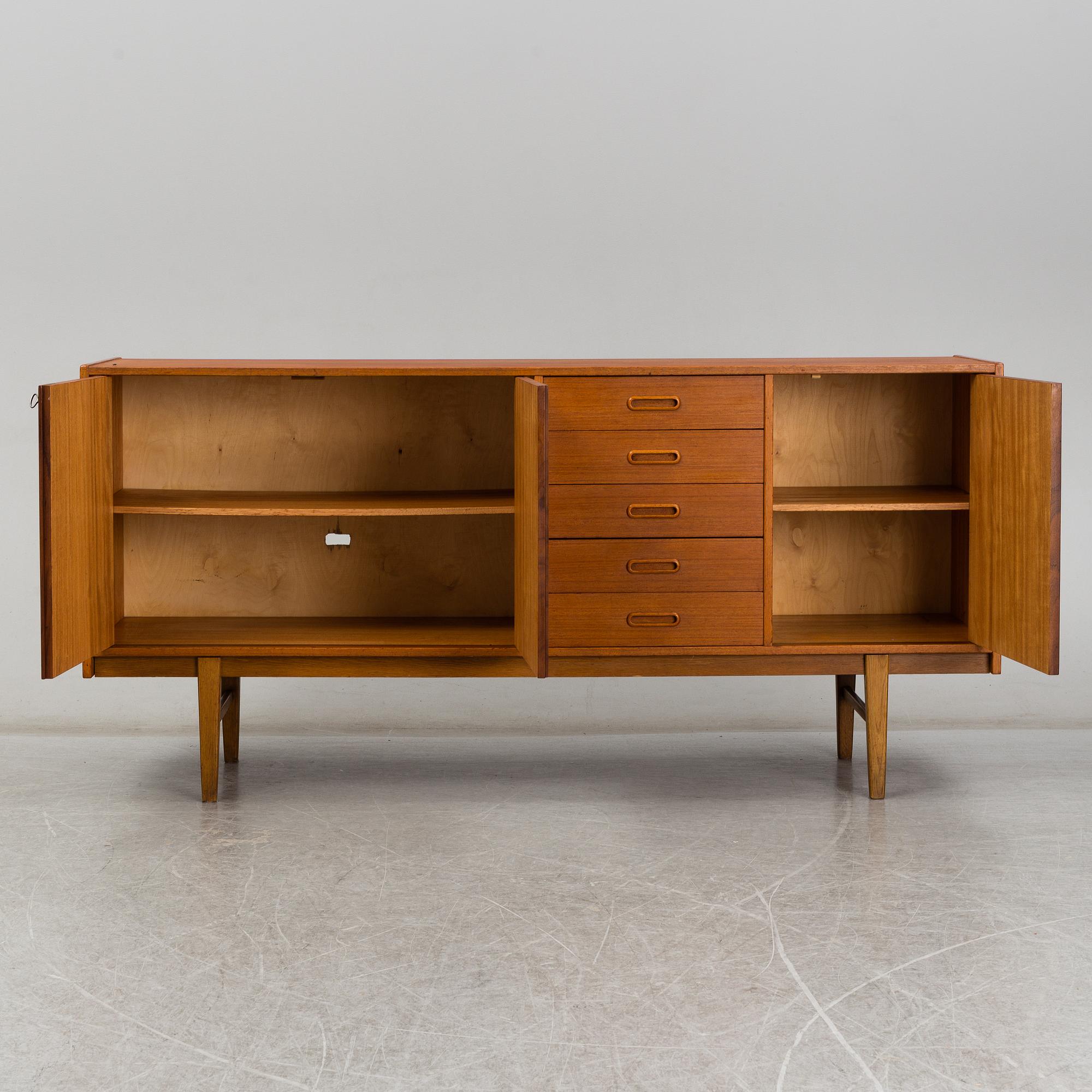 A 1960's teak vaneered sideboard.