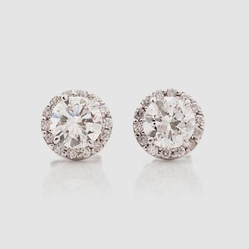 1369. A pair of brilliant-cut diamond solitaire earrings. Total carat weight circa 2.44 cts.