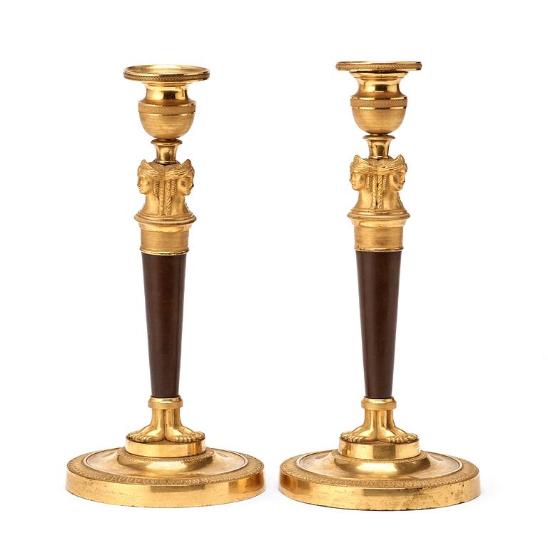 A pair of French Empire early 19th century candlesticks.