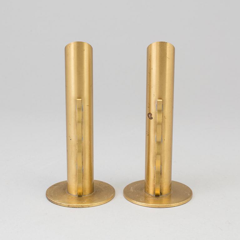 A pair of Swedish brass candlesticks/vases, mid 20th Century.