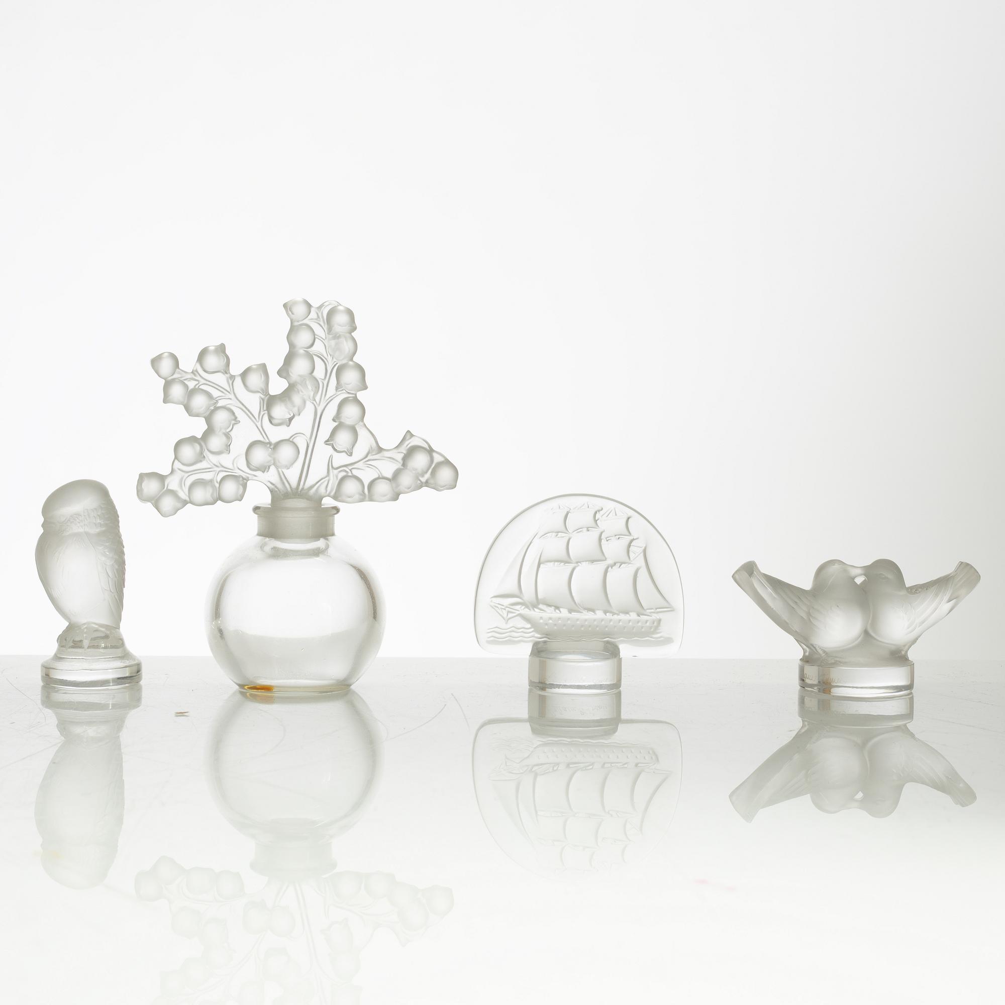Lalique, four perfume bottles and five figurines, France, after 1945.