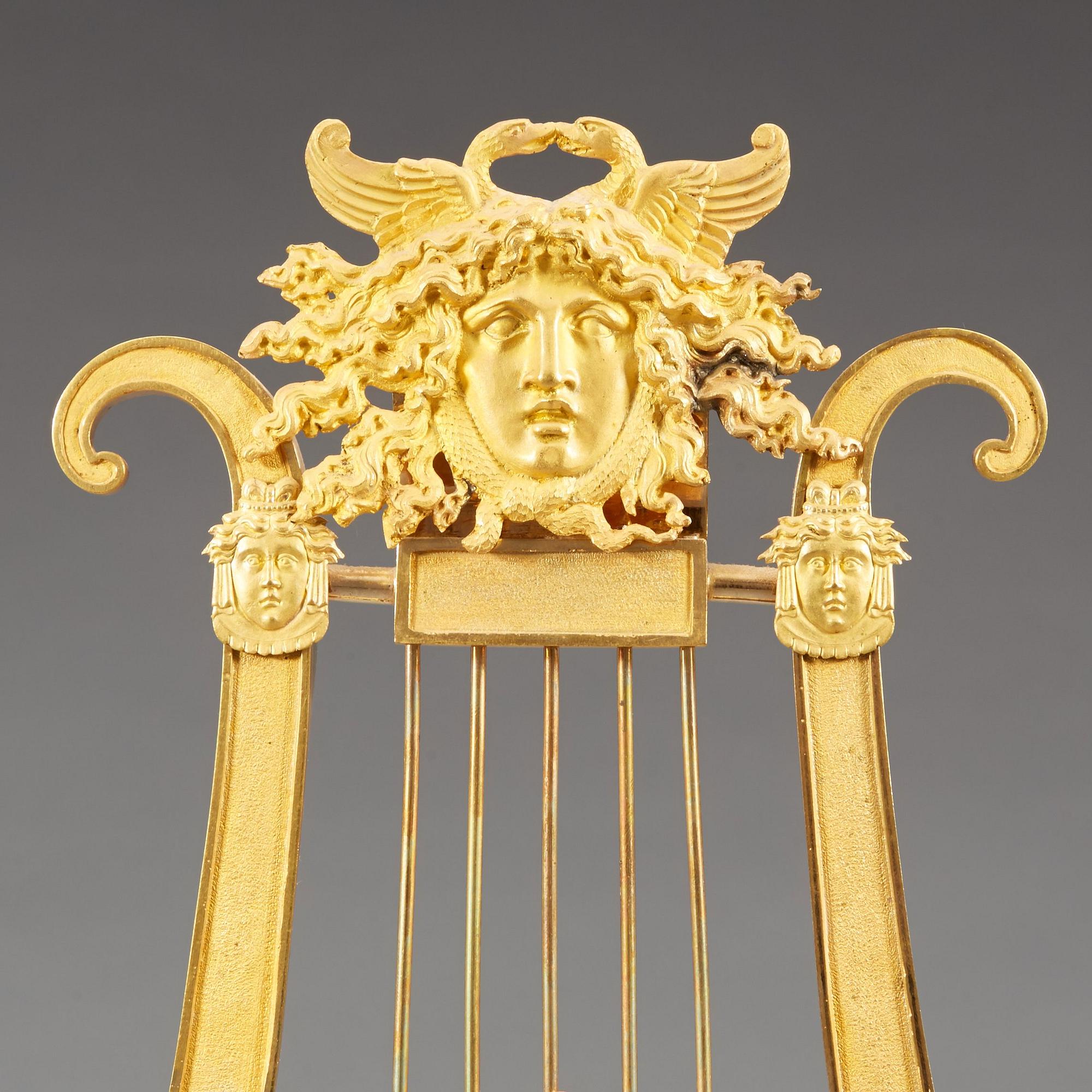 A late Gustavian early 19th century gilt bronze mantel clock.