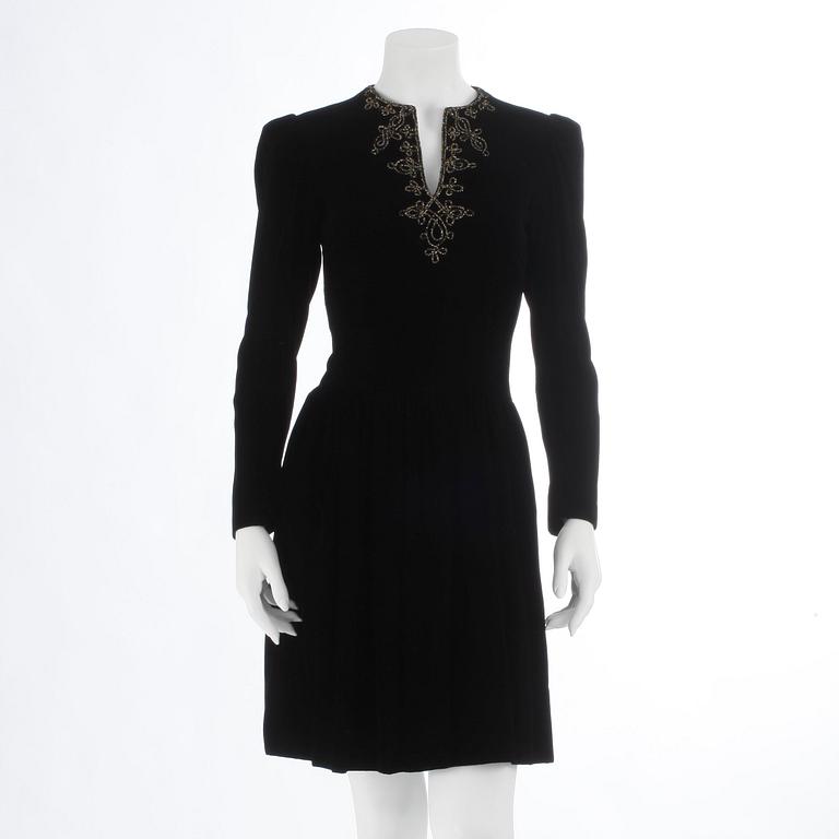 OSCAR DE LA RENTA, a black velvet dress with beading.