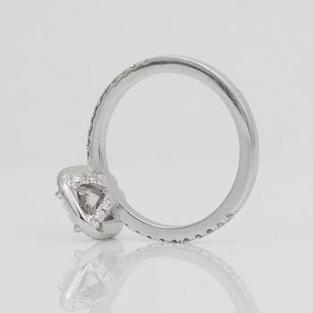 A 1.04 ct cushion-cut diamond ring surrounded by pavé-set brilliant-cut diamonds. Quality D/IF according to certificate.