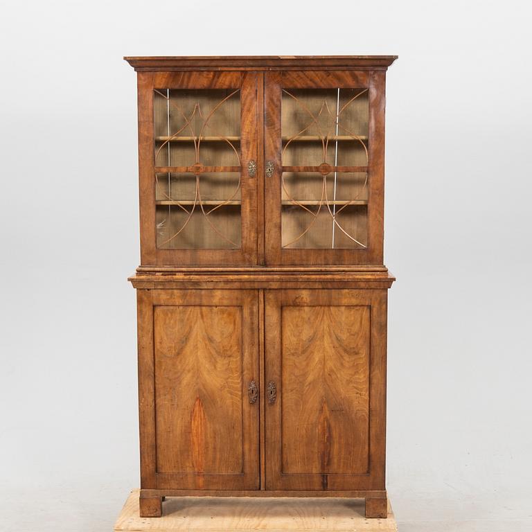 A mid 1800s mahogany book cabinet.
