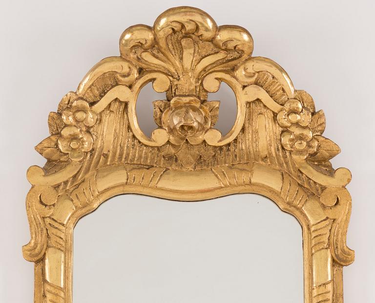 An early 20th century rococo style mirror.