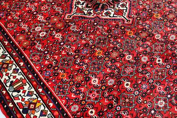 A Hosseinabad carpet, c 301 x 215 cm.