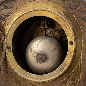 A mantle clock with pair of candelabra, late 19th century.