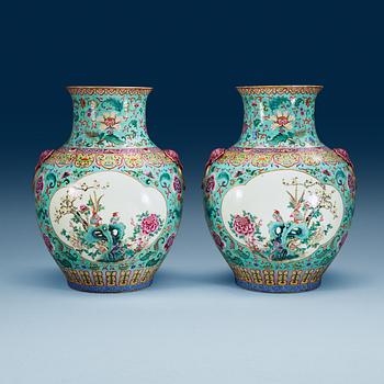 A large pair of turquoise ground famille rose vases, early 20th Century with Qianlongs sealmark.