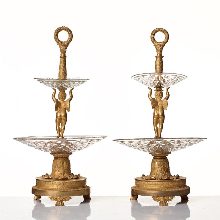 A pair of French Empire early 19th century gilt bronze and glass centre pieces in the manner of Pierre Philippe Thomire.