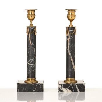 A pair of Gustavian black marble candlesticks.