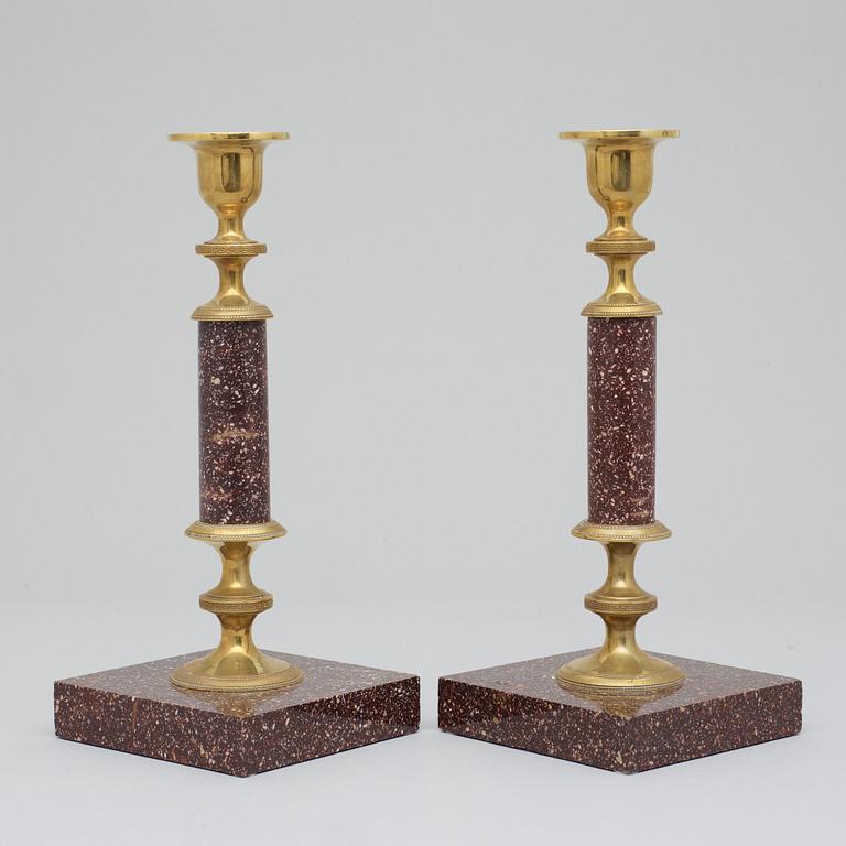 A pair of Swedish late 19th century porphyry candlesticks.