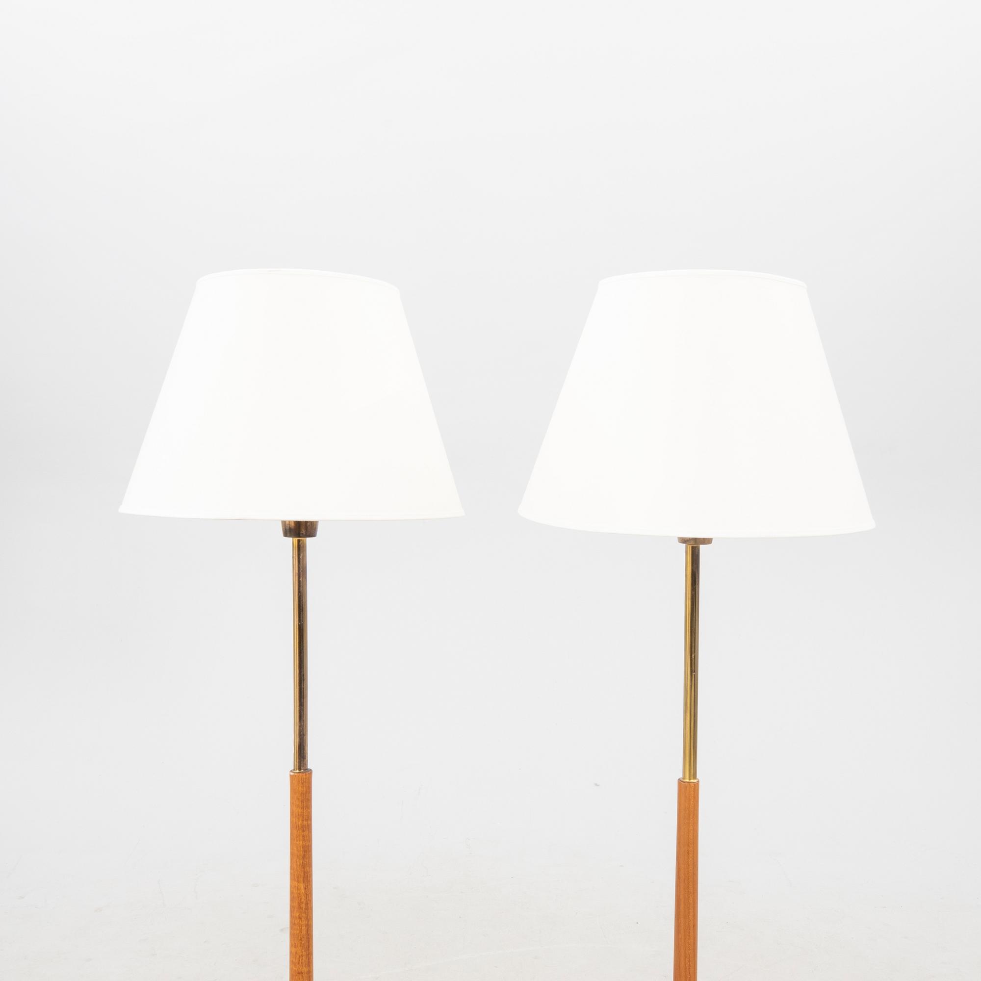 A pair of 1960s teak floor lamps.