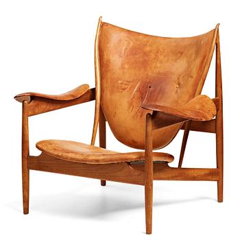 310. Finn Juhl, a teak and natural brown leather "Chieftain Chair" by Niels Vodder, 1950-60's.