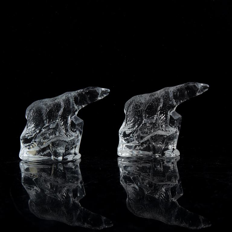 Nine glass polar bears.