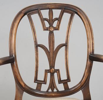 An Axel Einar Hjorth set of 4 Swedish Grace chairs and a pair of armchairs, 'Östanå', Nordiska Kompaniet, 1929.